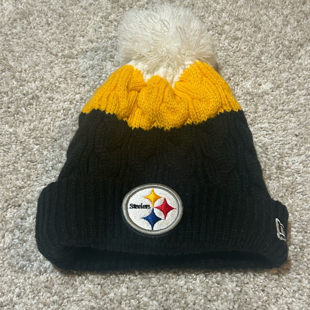 New Era Woman’s Steelers Knit Pom Beanie in Black, Gold & White